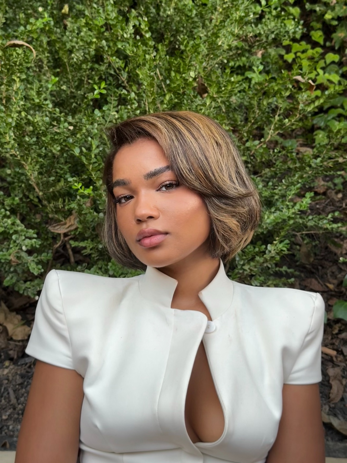 Front view of a dimensional highlighted bob by Moncure Beauty