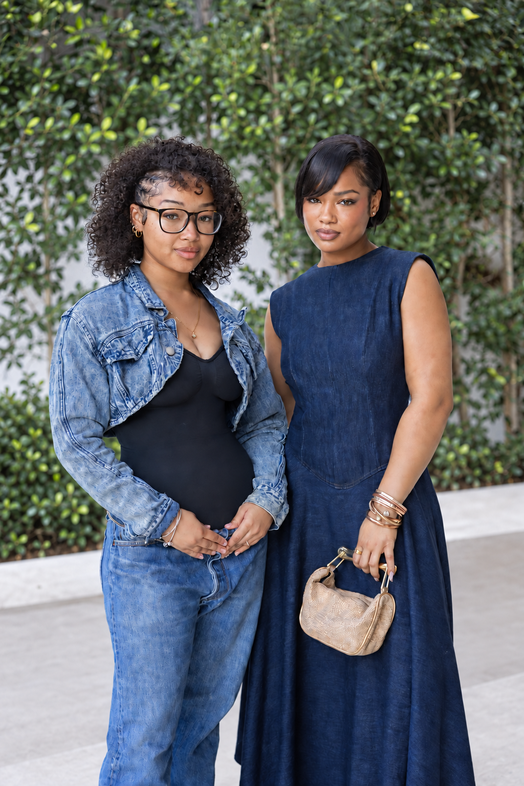 Two Moncure Beauty clients showcasing polished natural curls and a precision short style